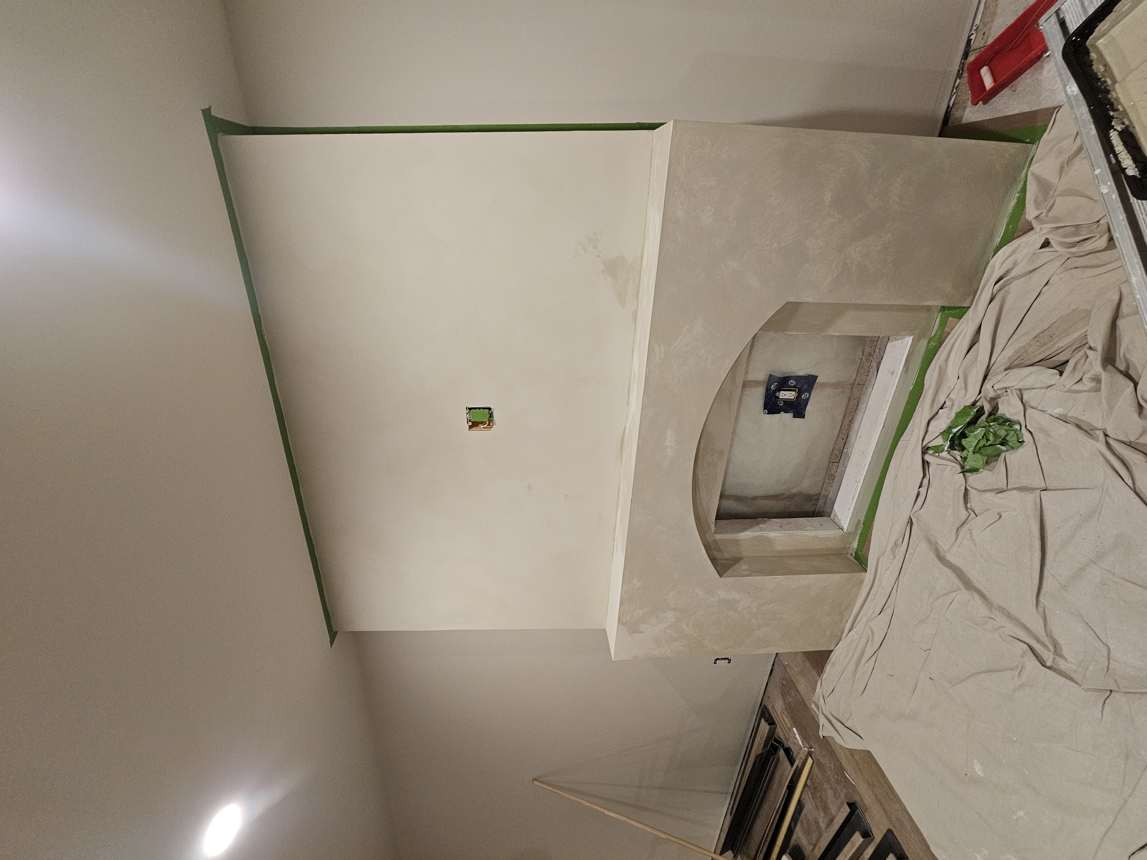 Fireplace surround part-way through plastering